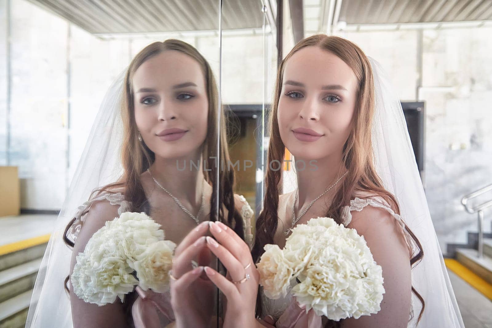 Bride stands with bouquet, reflecting joy and love in a contemporary setting ahead of her wedding registration.