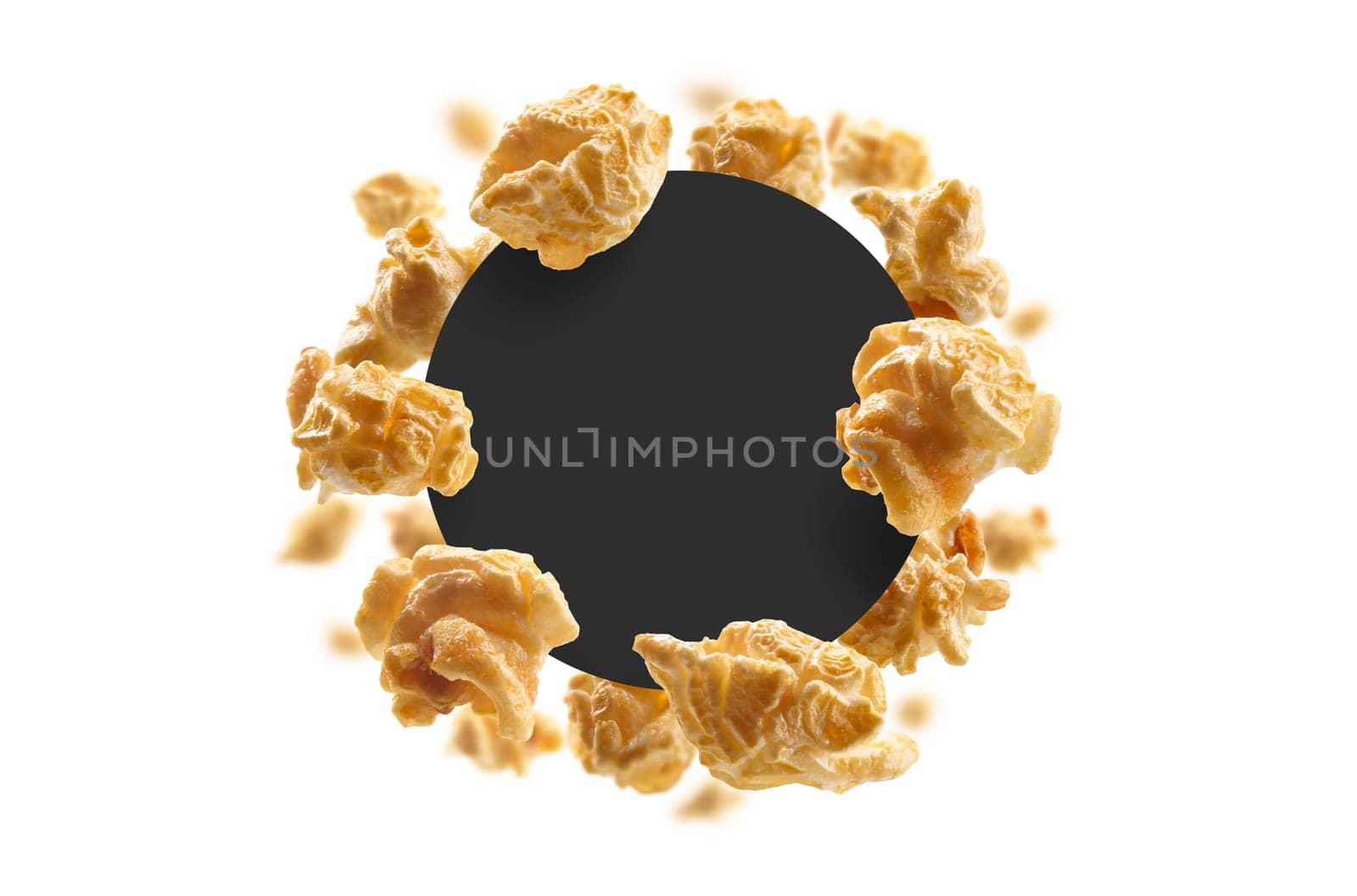 Caramel-flavored popcorn on a white background with a black circle in the center. The template for packaging