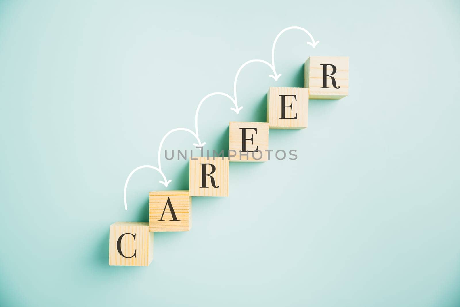 A compelling composition featuring a wooden cube block with the word CAREER against a vibrant blue background. Conveys the idea of business career planning, growth, and the steps towards success.