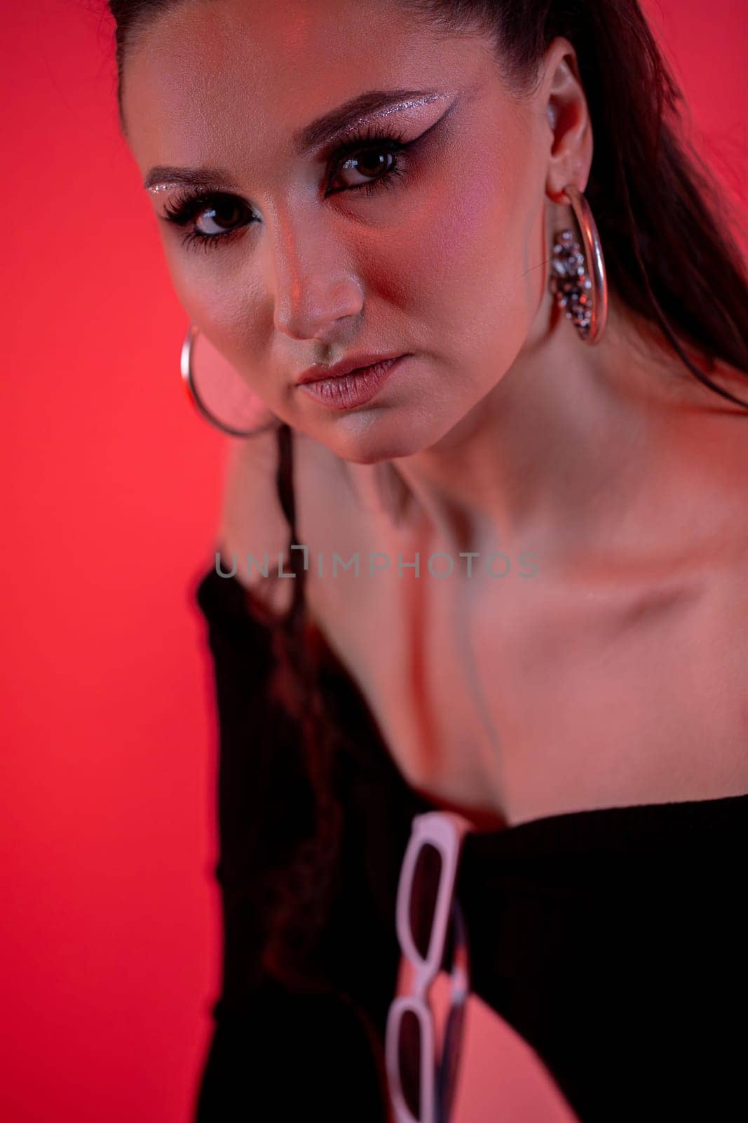A captivating and visually stunning fashion portrait showcasing striking makeup along with vibrant and vivid colors