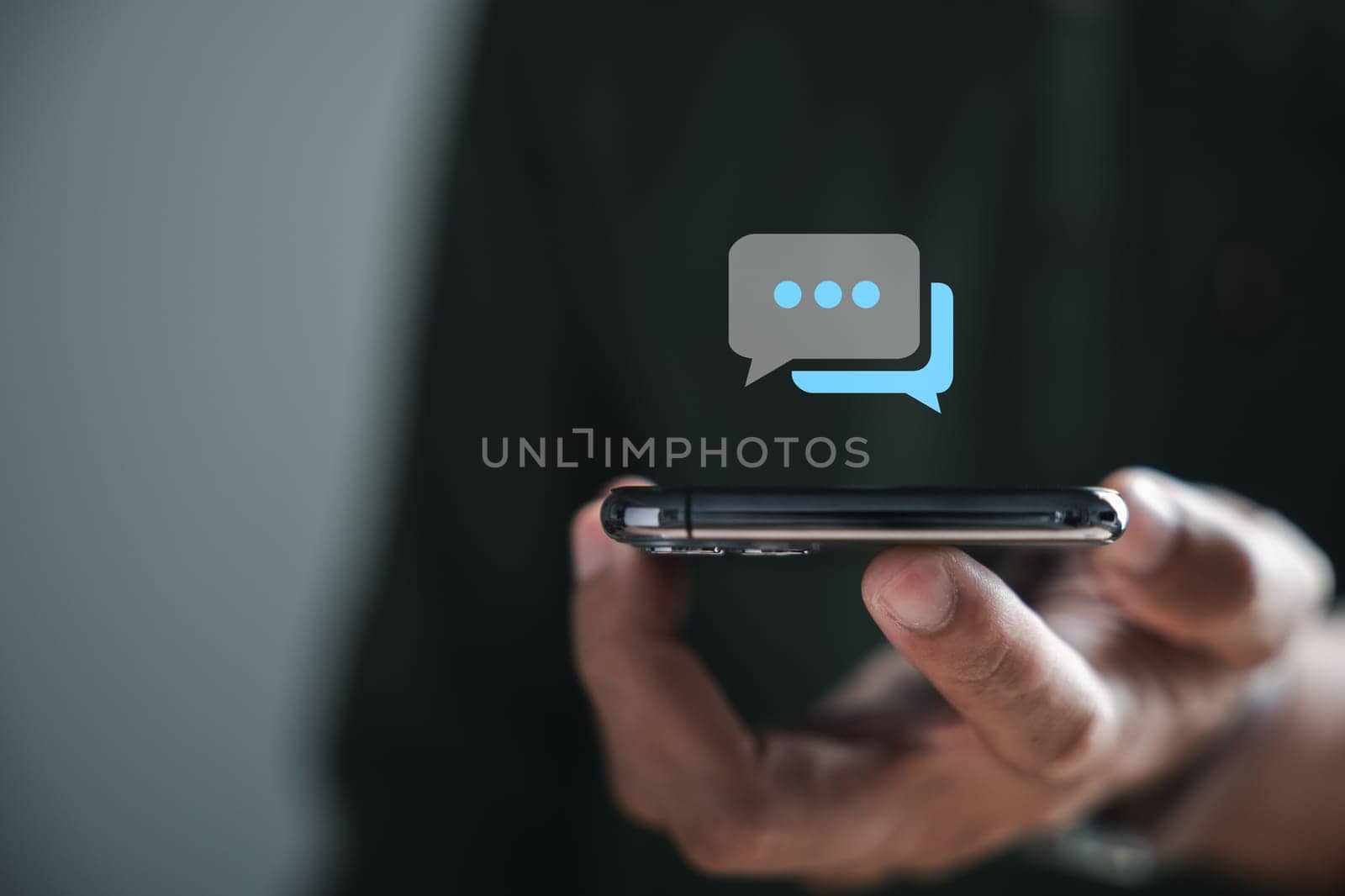 Man engagement in live chat through his smartphone symbolizes fusion of social networking and chatting concepts. Chat box icons pop up, seamless integration of technology in social medimarketing.