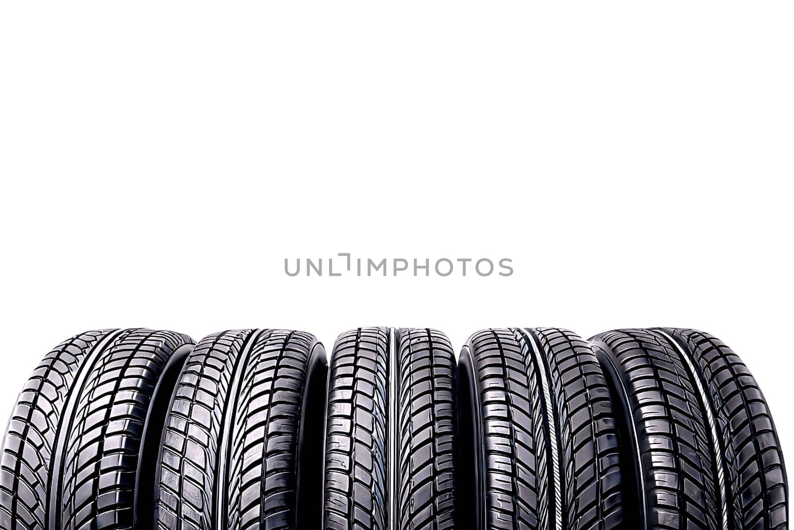 Replacing a car wheel at a tire station. a rubber covering, typically inflated or surrounding an inflated inner tube