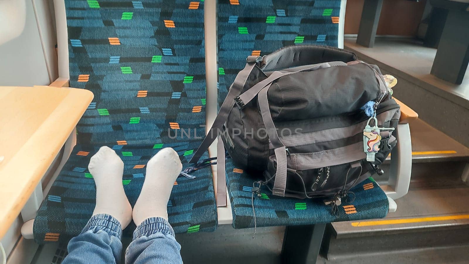 Benesov Czech Republic Europe October 18 2024 Feet backpack train women travel tourism transport editorial shotlisttravel table objects sitting waiting . High quality photo