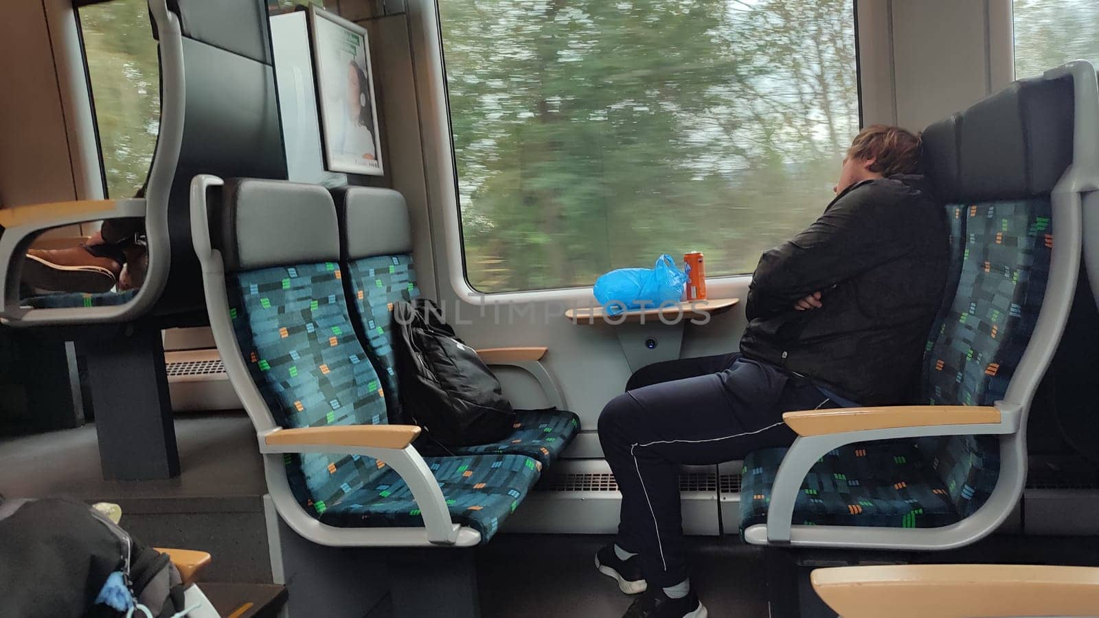 Prague Chech Republic Europe October 18 2024 -Train passenger sleeping. High quality photo