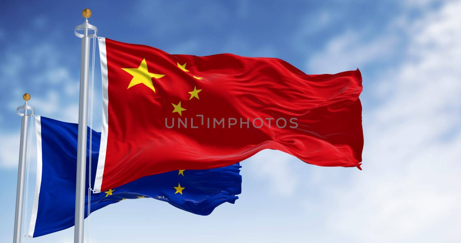 Flags of China and European Union waving in the wind on a clear day. International relations. 3d illustration render. Rippling fabric