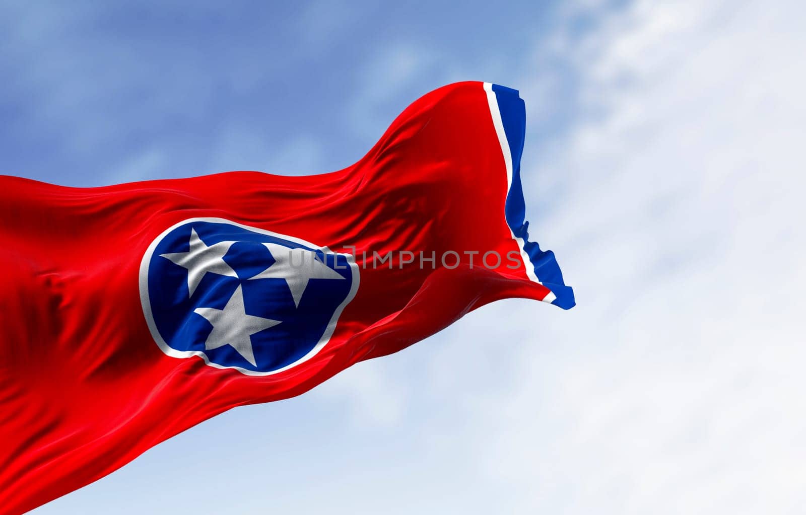 Close-up of the Tennessee state flag waving. Red field with a blue circle in the center containing three white stars. US state flag. 3d illustration render. Fluttering fabric. Selective focus