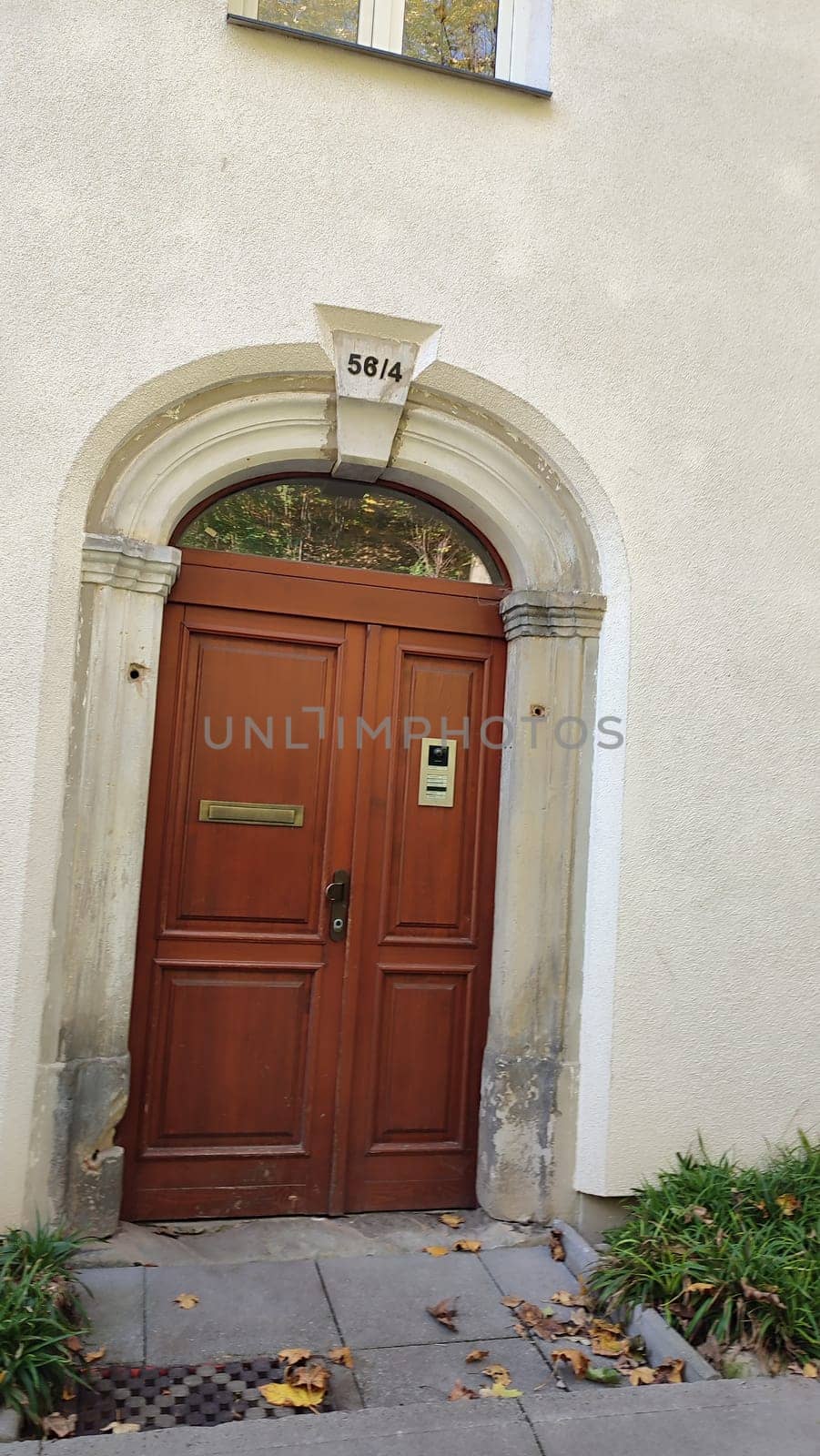 Brown wooden door building architecture street windows shotlisttravel travel tourism home hotel apartment house village number place destination objects . High quality photo
