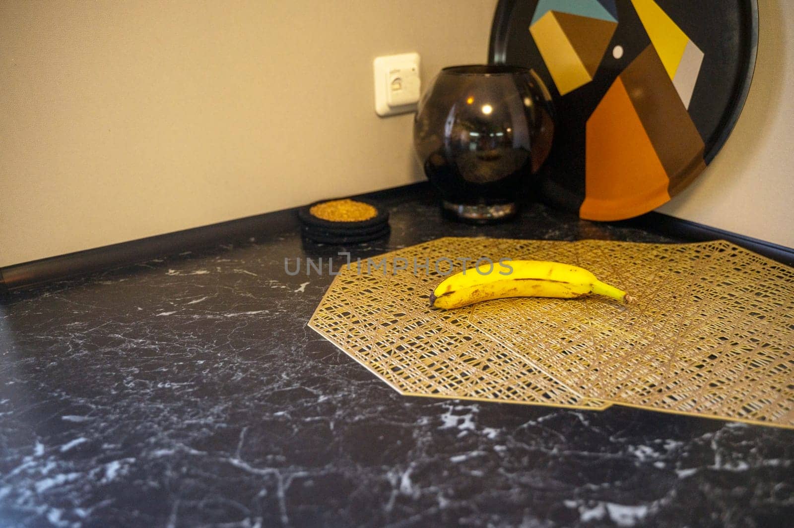 A banana sitting on top of a table. High quality photo