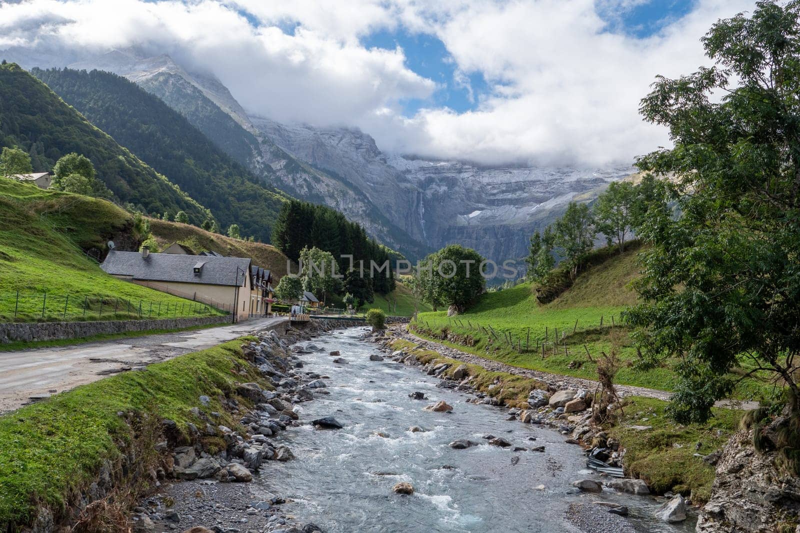 The Cirque of Gavarnie, french Pyrenes mountains. The mountains are covered in snow and the sky is cloudy