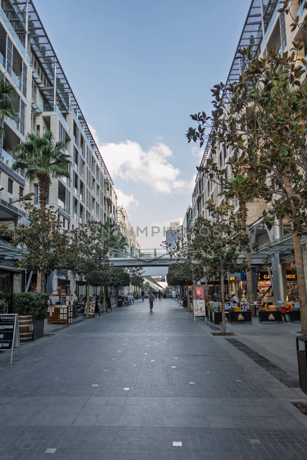 Amman, Jordan - 12 November 2024: Shops and modern apartments line the street in Abdali Mall