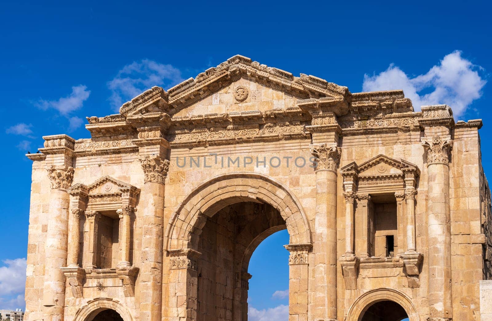 The monumental gateway of Hadrian's Arch in Jerash, a Greco-Roman well preserved city in Jordan