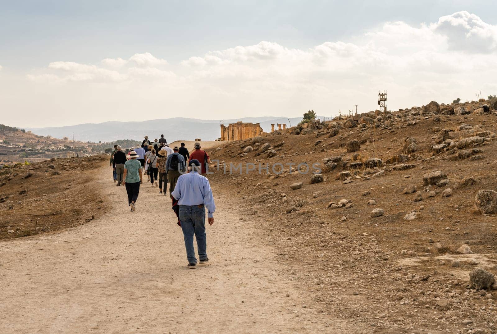 Tourists walking between monuments in Jerash, a Greco-Roman well preserved city in Jordan