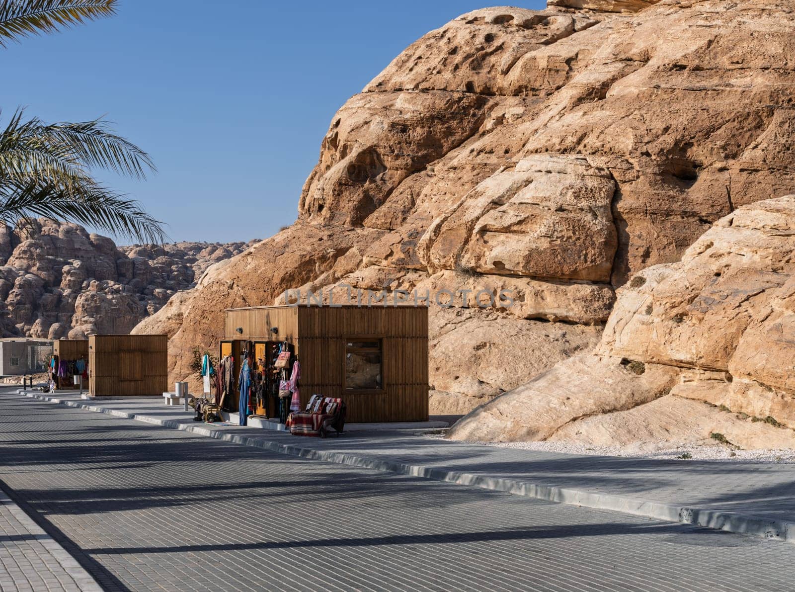 A picturesque view of Petra's cultural village, displaying shops with scenic rock formations.