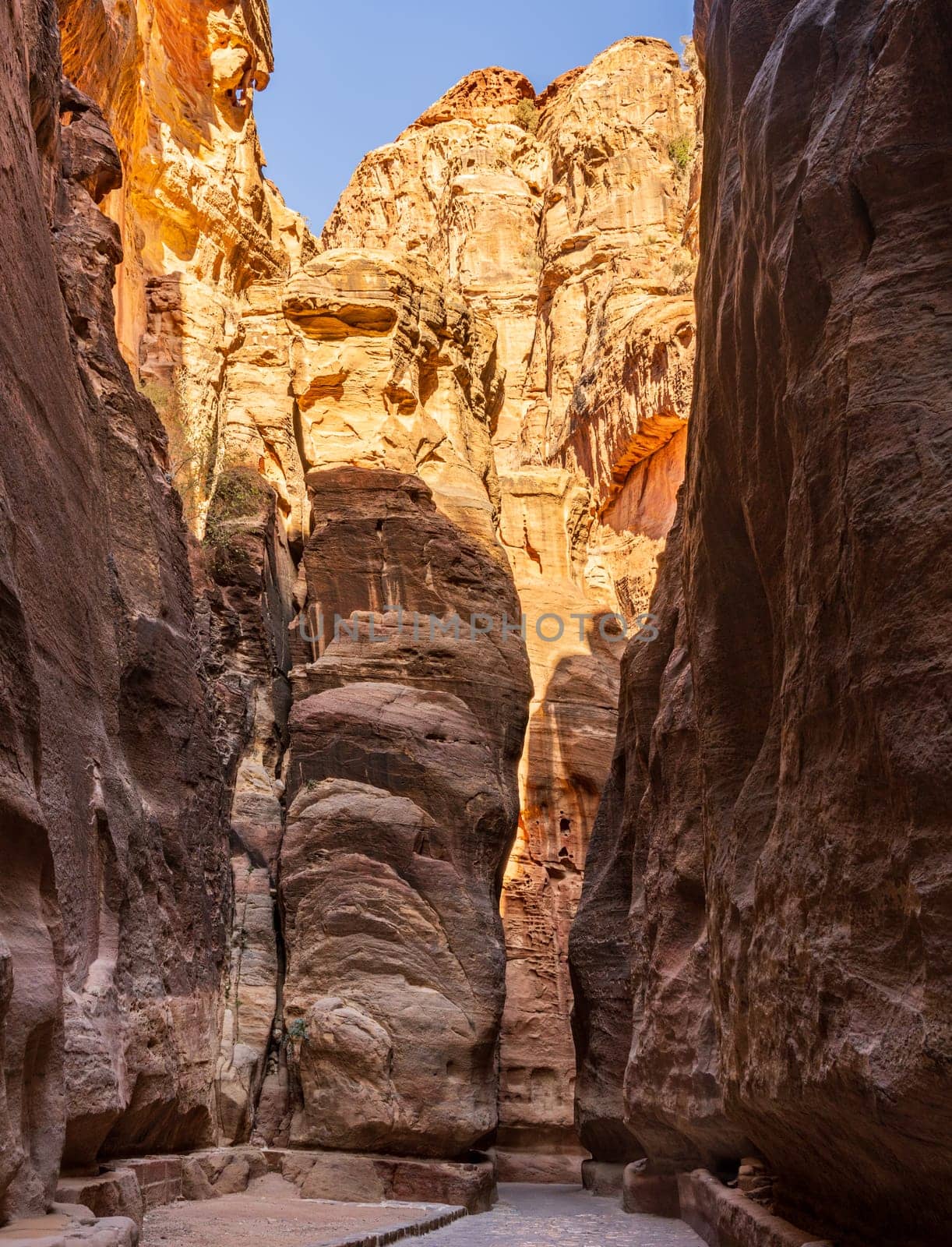 Water channels carved on both sides of the narrow gorge of the Siq entering Petra in Jordan