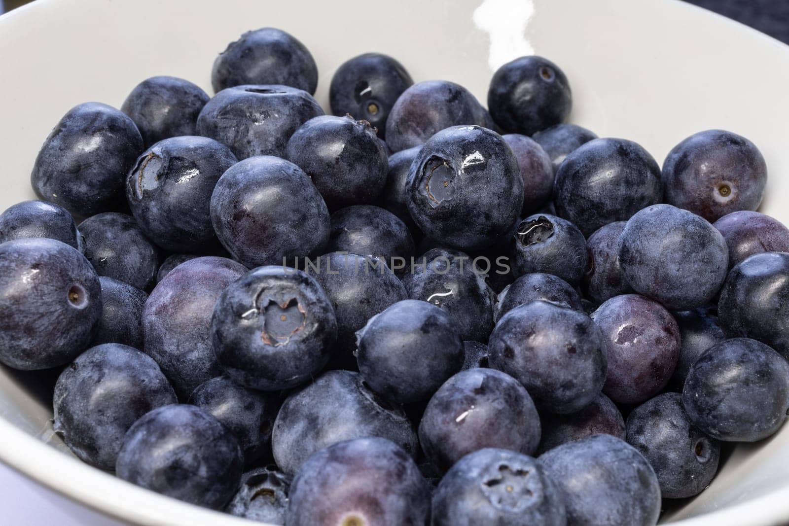delicious blueberry with ripe fruit in close up