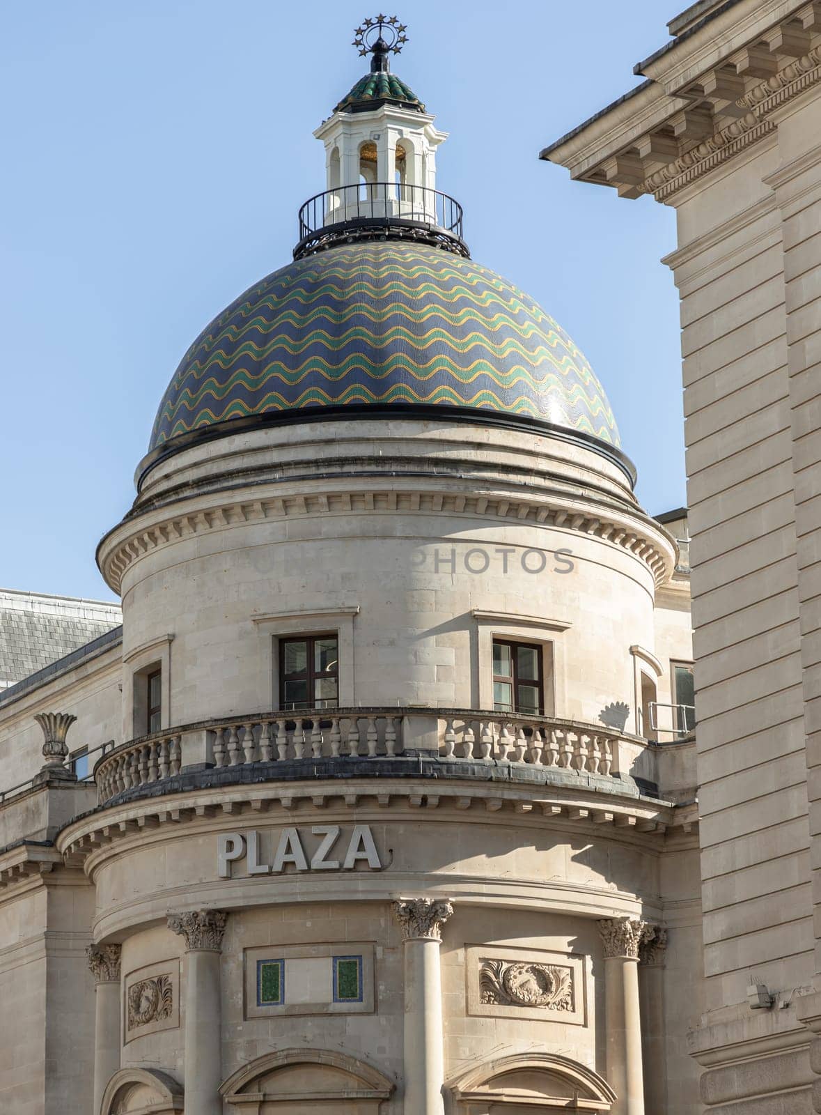 London, UK - May 13, 2025 - Architecture splendour of The Plaza Theatre building now London’s luxury Apollo Cinema (Vue Cinemas) with Intricately tiled domed roof in Lower Regent Street London. use it as your Wallpaper, Poster and Copy space, Selective focus.