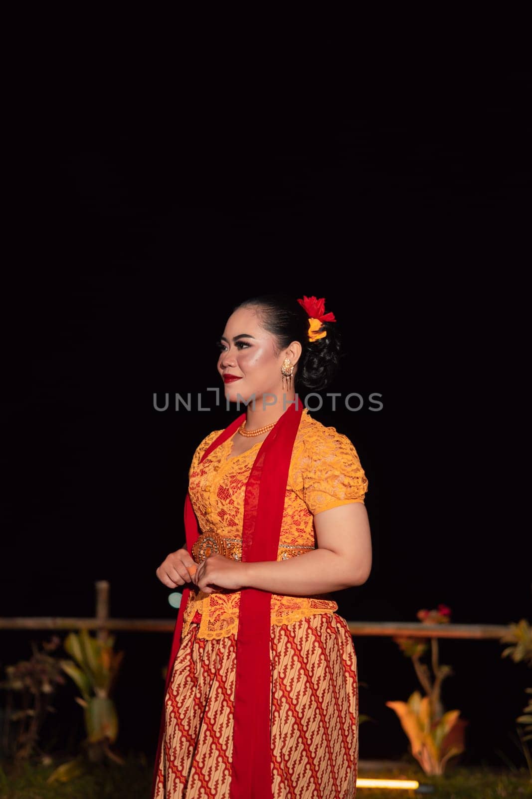 gorgeous Balinese woman showing and performing traditional dress from Indonesia at the fashion festival