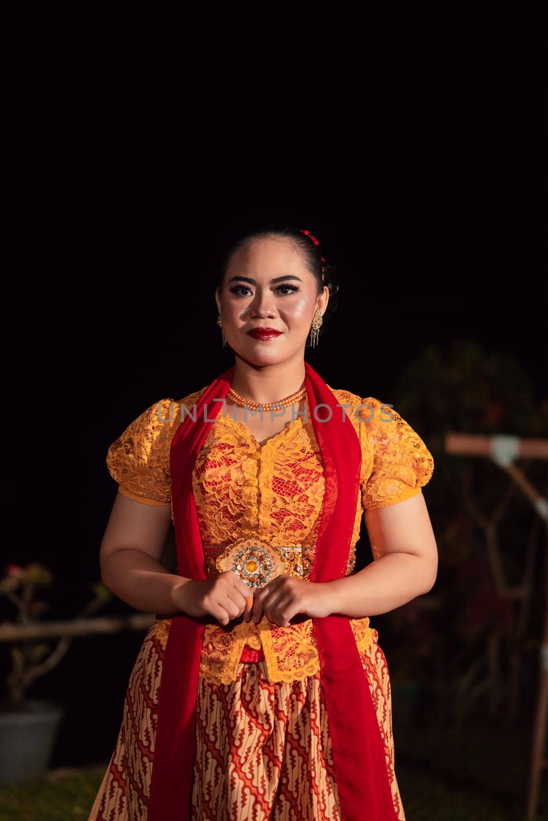 gorgeous Balinese woman showing and performing traditional dress from Indonesia at the fashion festival