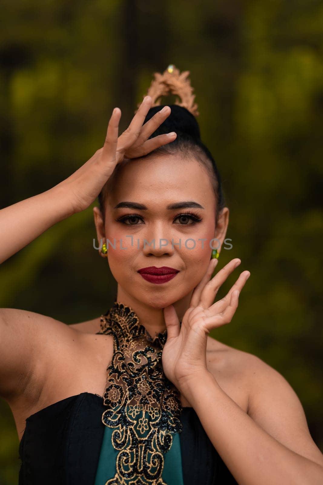 Beautiful face of a Javanese woman in a traditional dance costume before the dance performance begins inside the festival