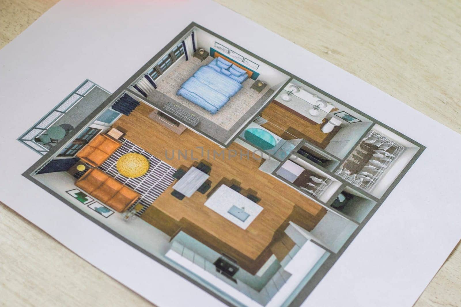 Layout of the small, furnished apartment printed on the sheet of paper placed on the desk