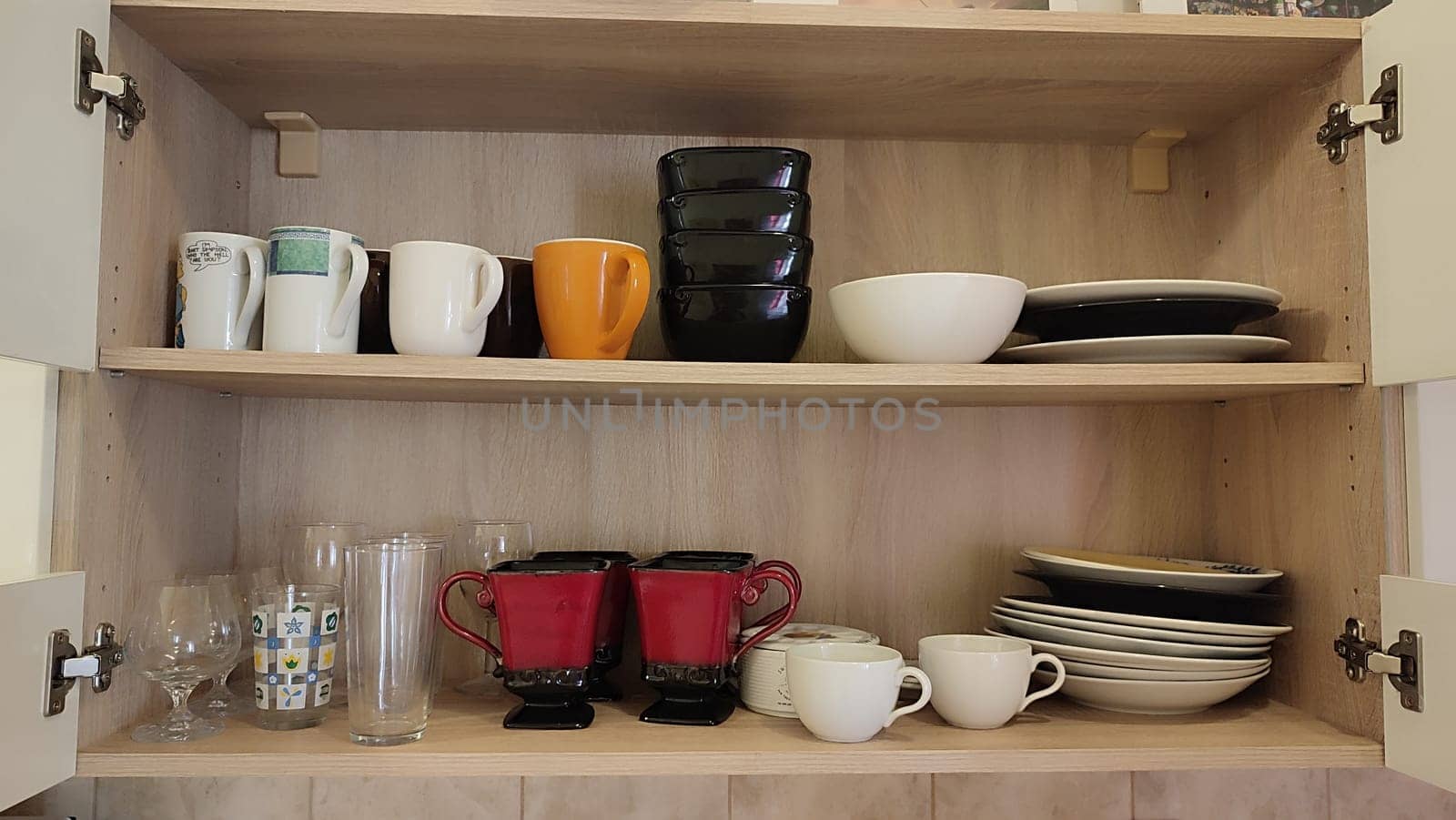 Kitchen cupboard dishes furniture objects glass glasses design house hotel apartment wooden room indoor home object . High quality photo