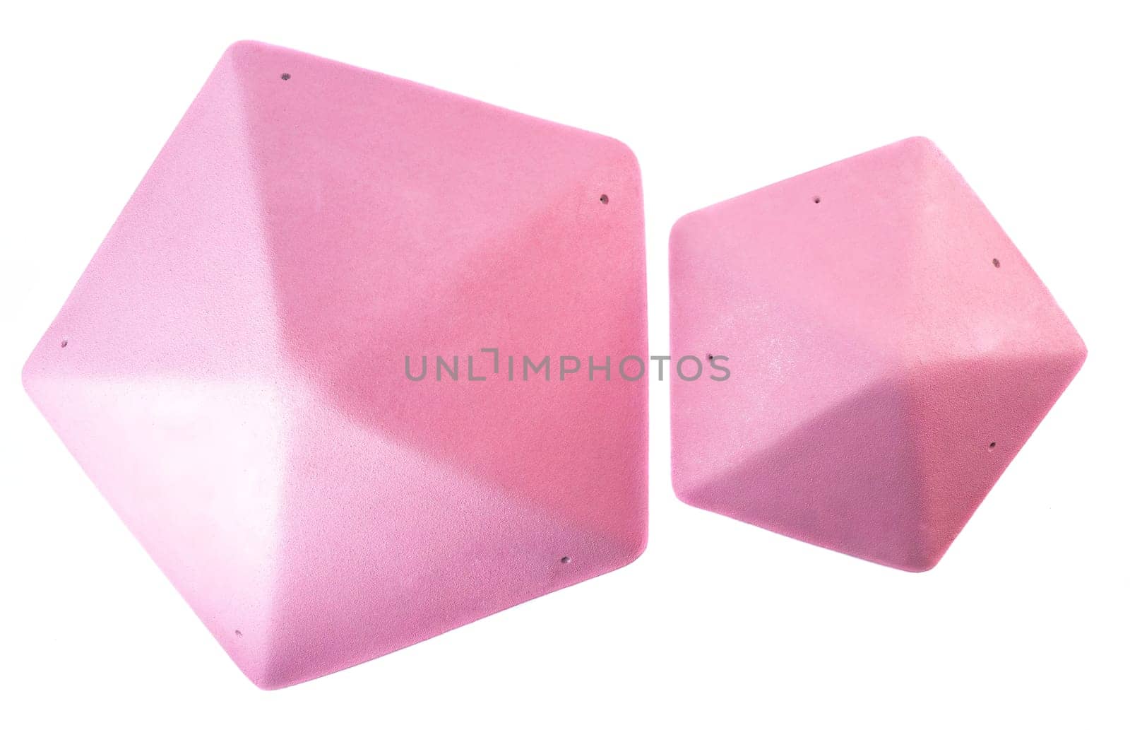 Set of pink triangular climbing volumes isolated on white background. Geometric holds for bouldering or gym training. Online store concept