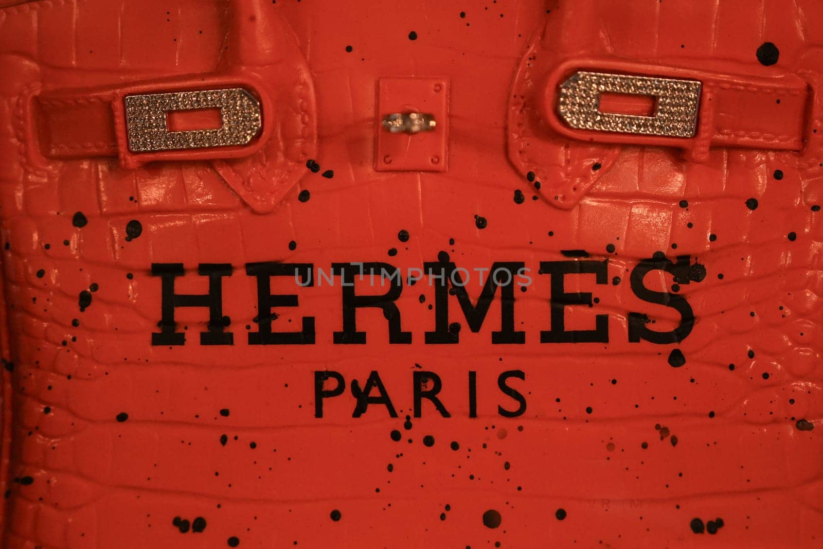 Paris , France - JANUARY 10, 2025 : Vintage Red Hermes Birkin Bag with Black Spots and Gold Clasp