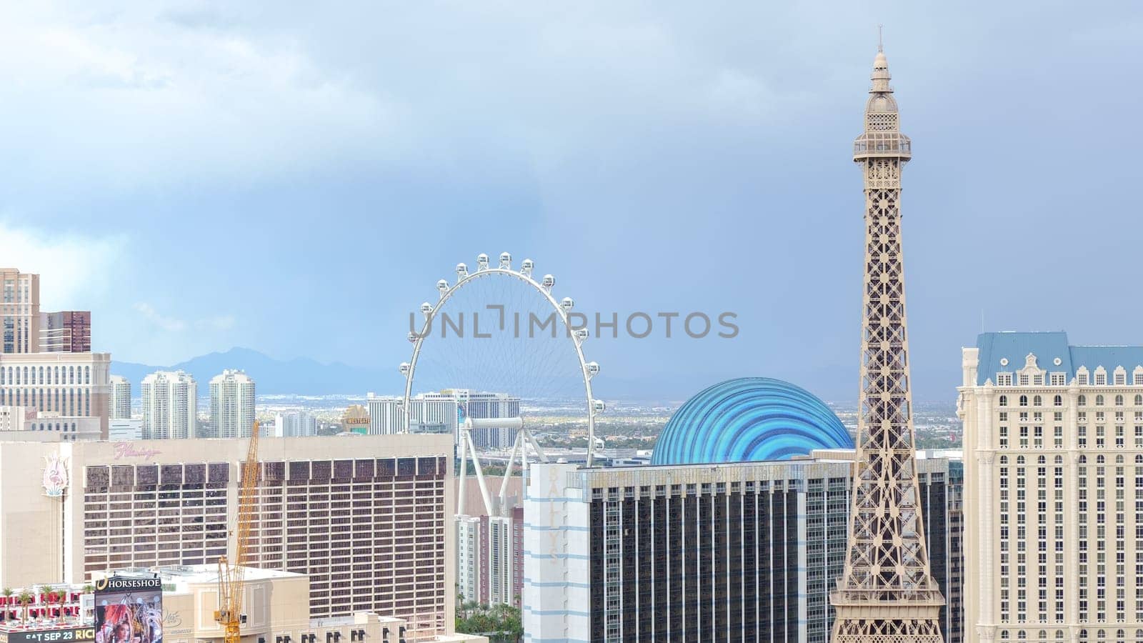 Captivating Night View of Las Vegas Skyline with Eiffel Tower and Bright Ferris Wheel Lights - Las Vegas NV USA - 19.09.2023.