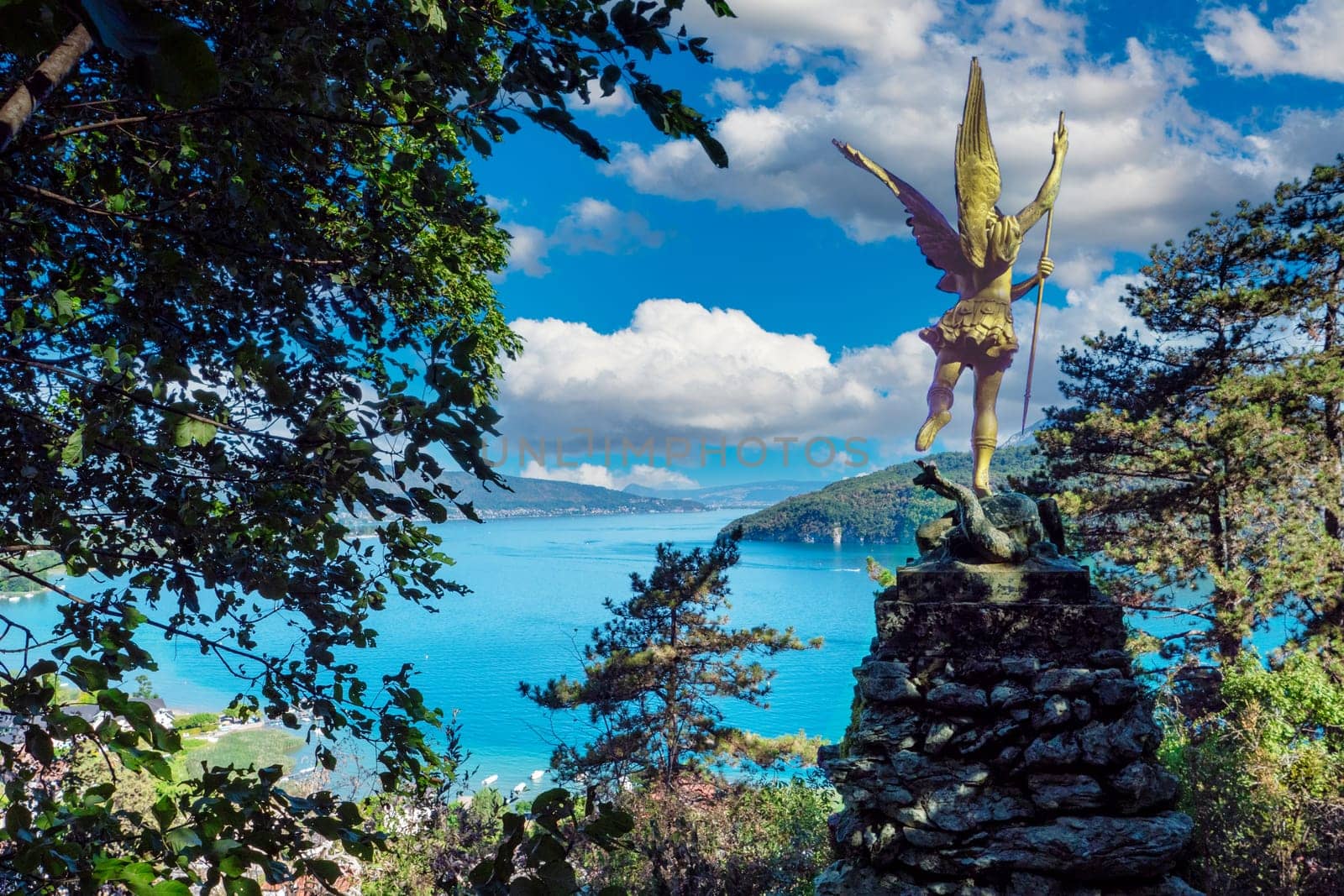the statue of Saint Michael located above Lake Annecy