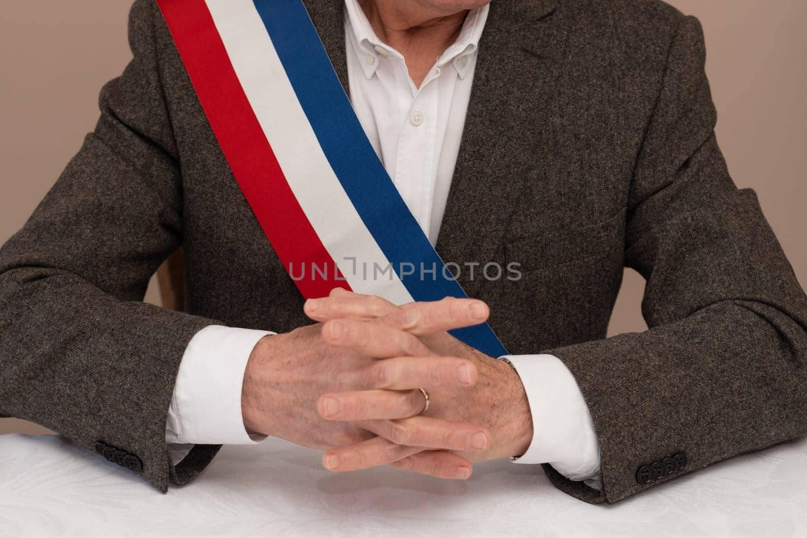 Mayor in France congratulates newlyweds French red blue white ribbon