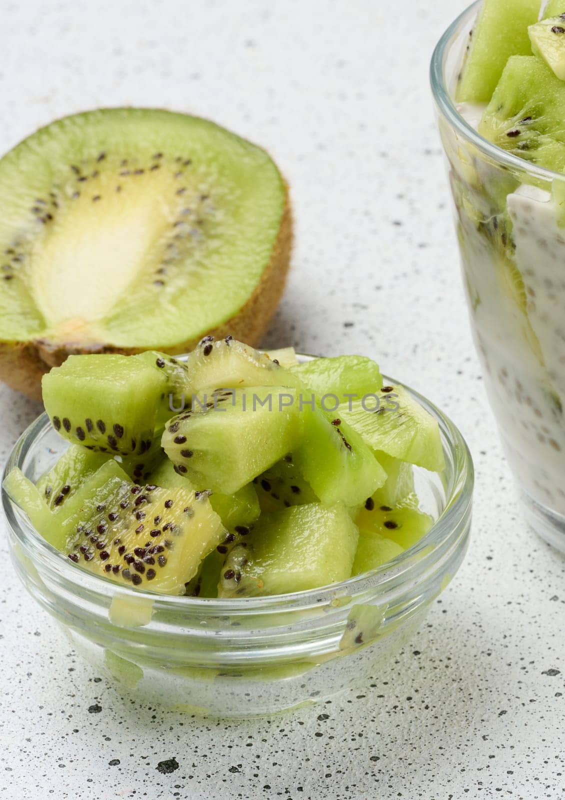 Diced kiwi in glass bowl, top view