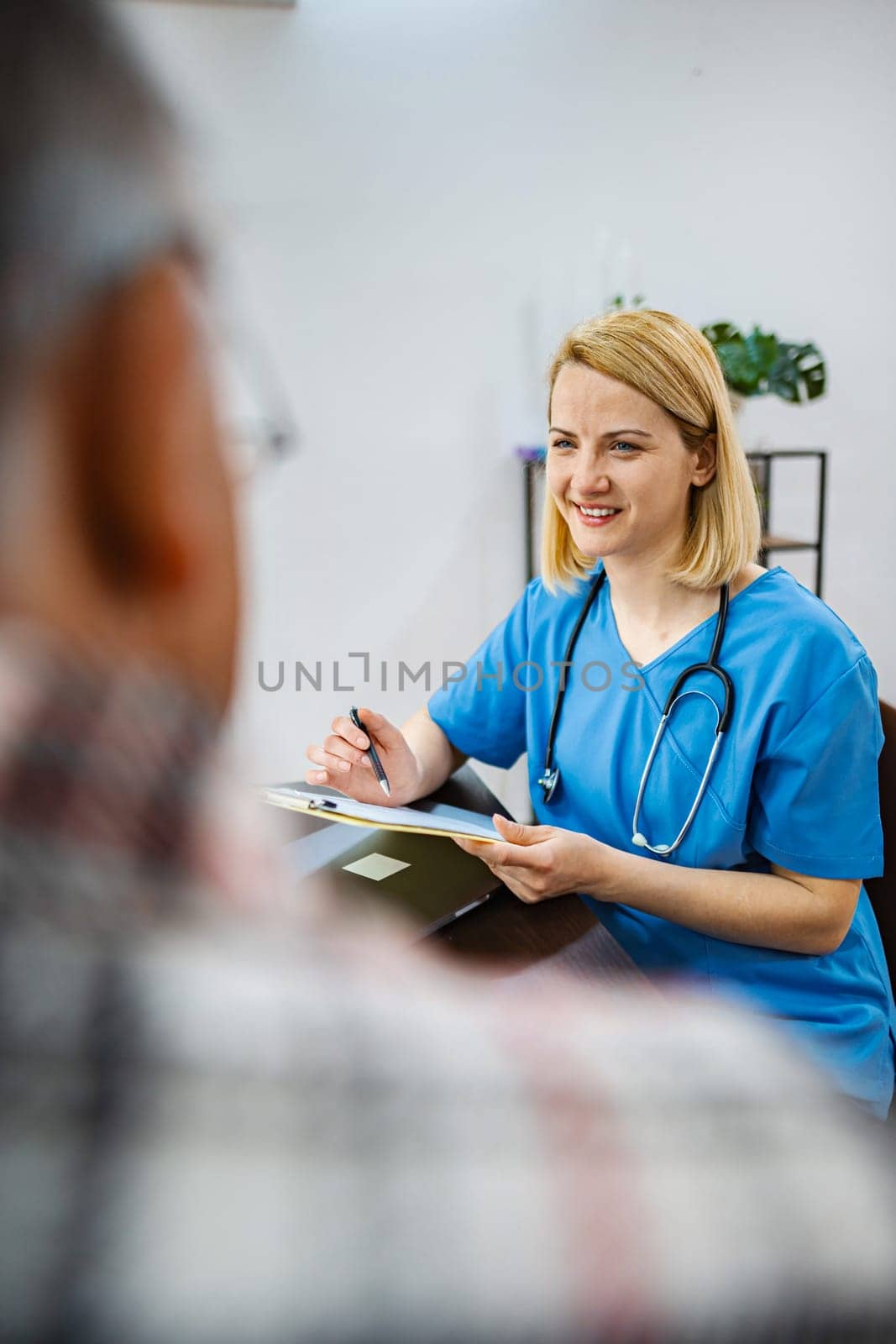 Doctor explains treatments as patient listens closely.
