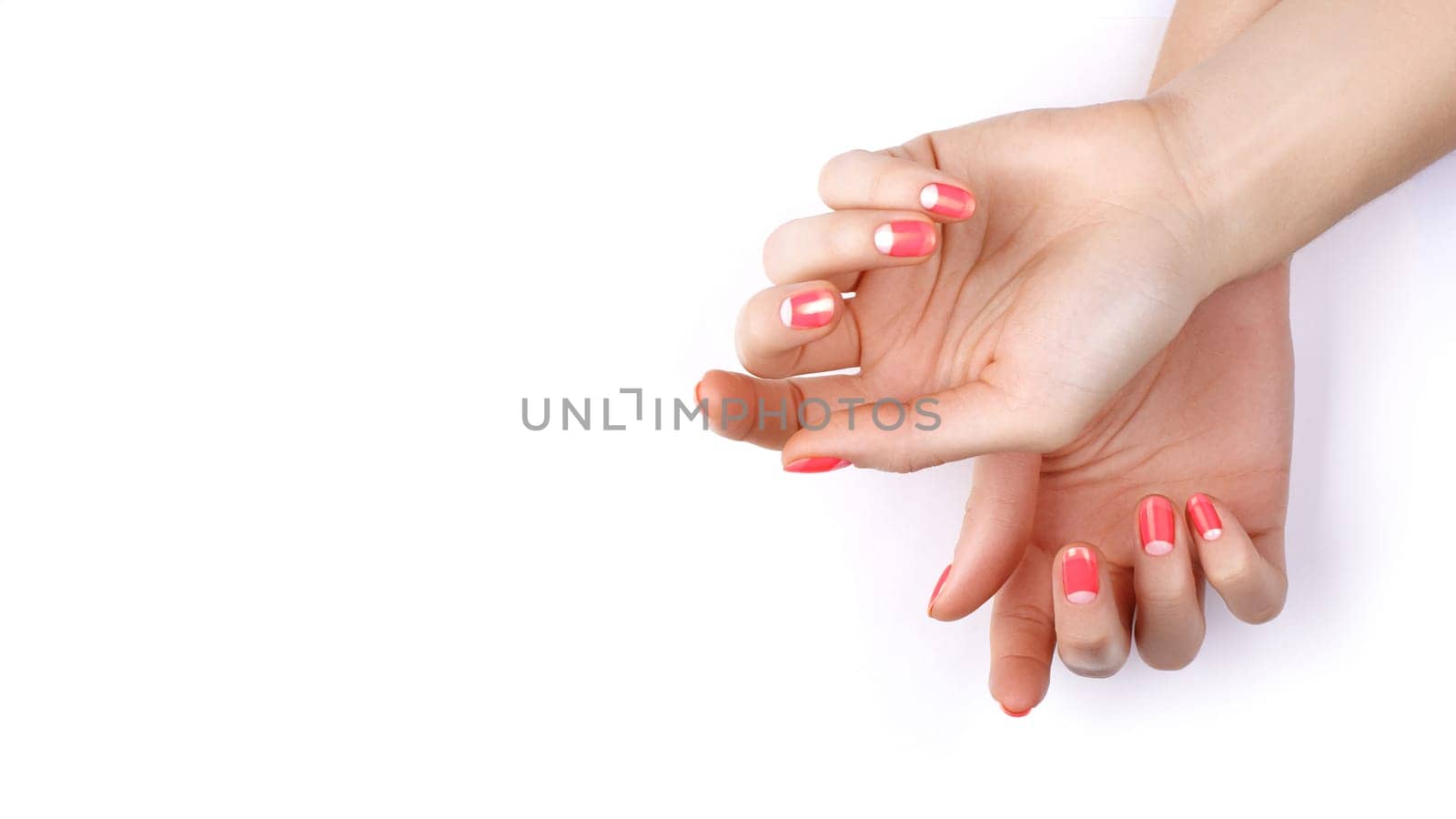 Nude manicure. Gel nail polish in light pink color. Beautiful manicure.