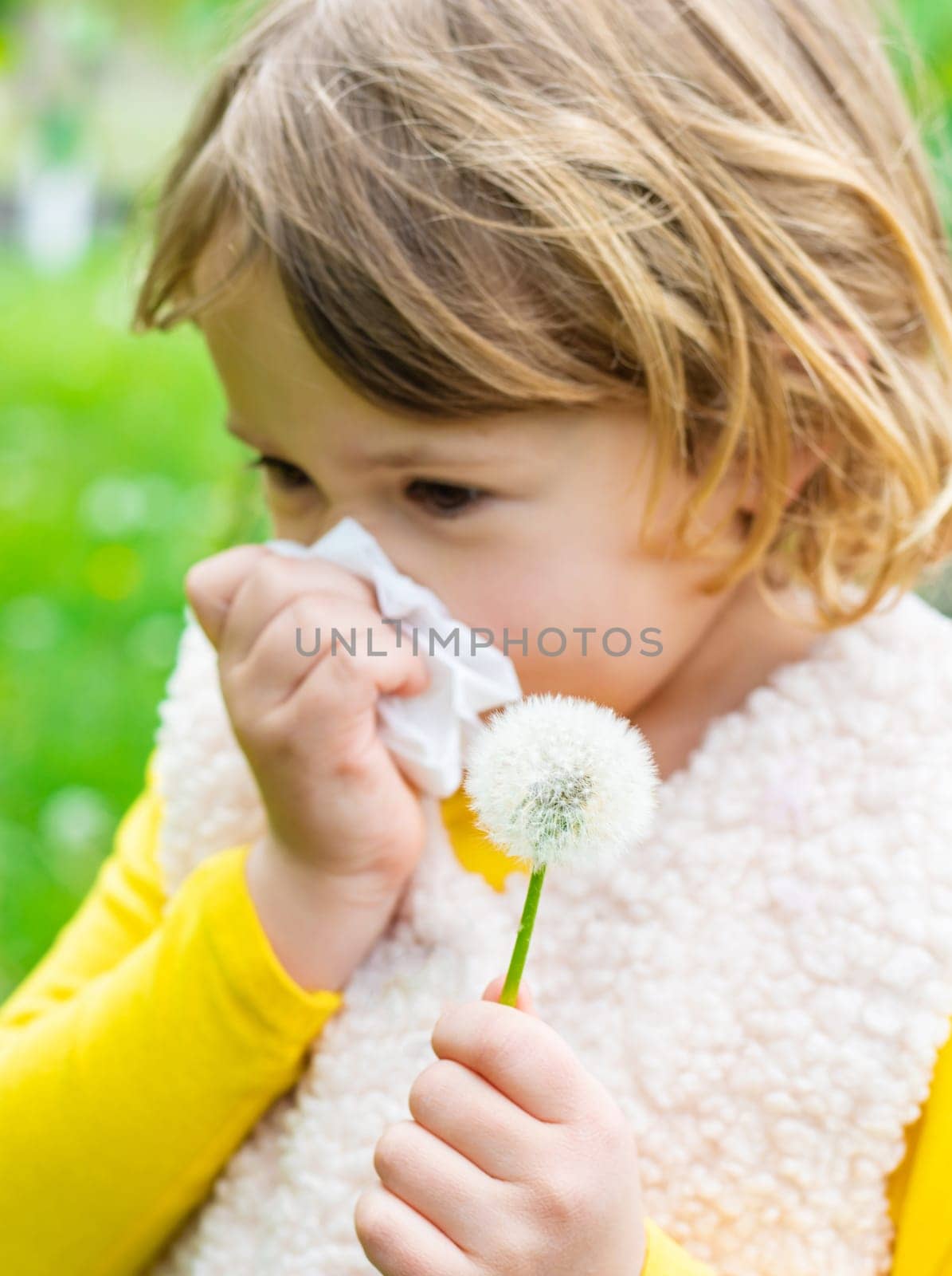The child is allergic to dandelions. Selective focus. Kid.