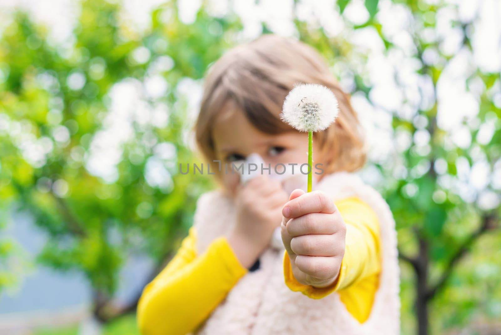 The child is allergic to dandelions. Selective focus. Kid.