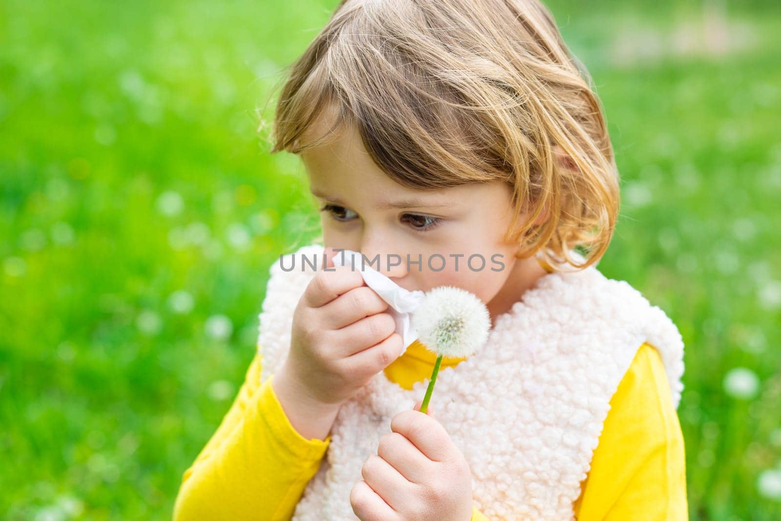 The child is allergic to dandelions. Selective focus. Kid.