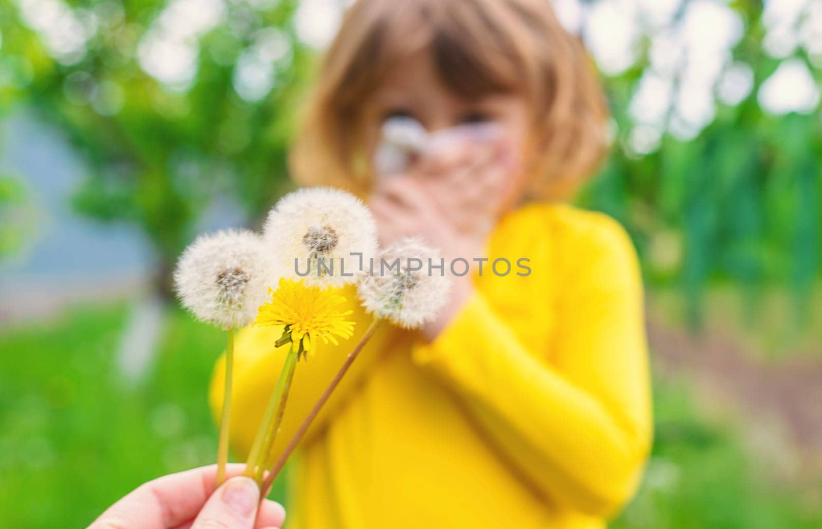 The child is allergic to dandelions. Selective focus. Kid.