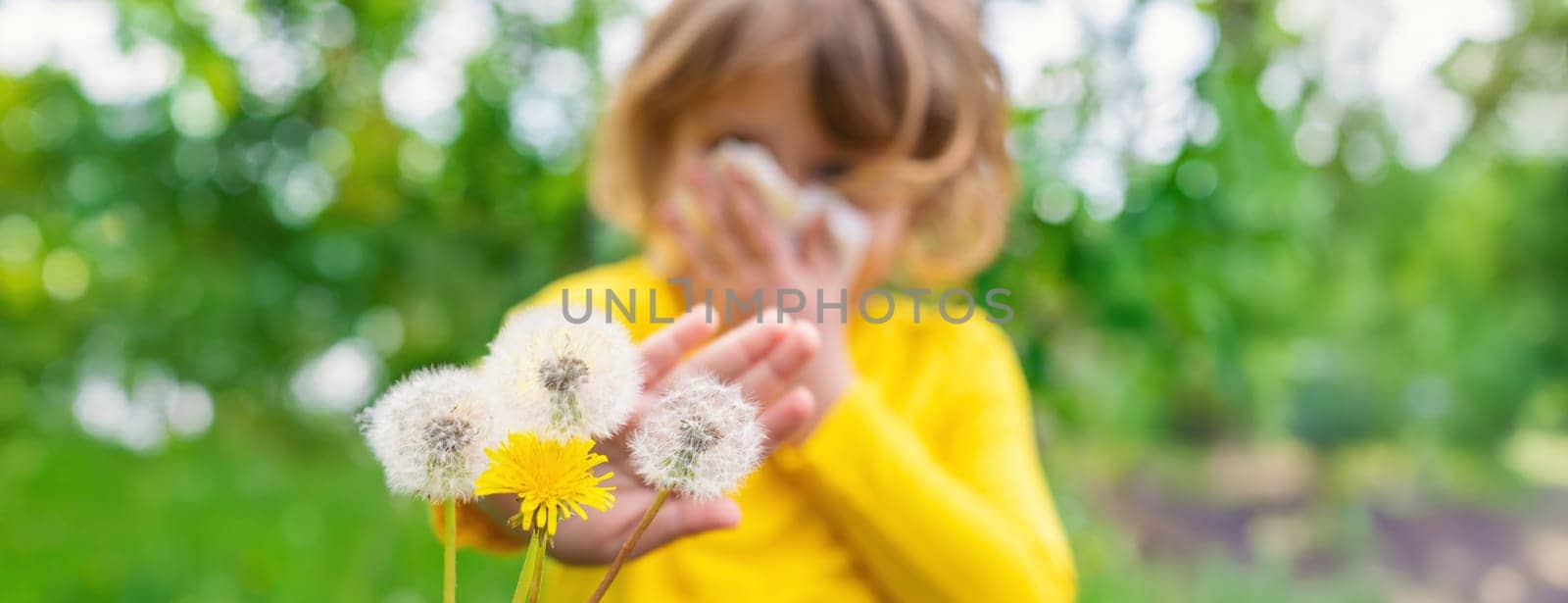 The child is allergic to dandelions. Selective focus. Kid.