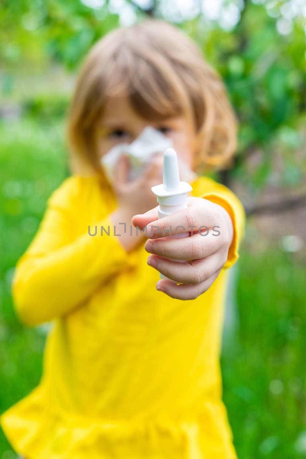 The child is allergic to dandelions. Selective focus. Kid.