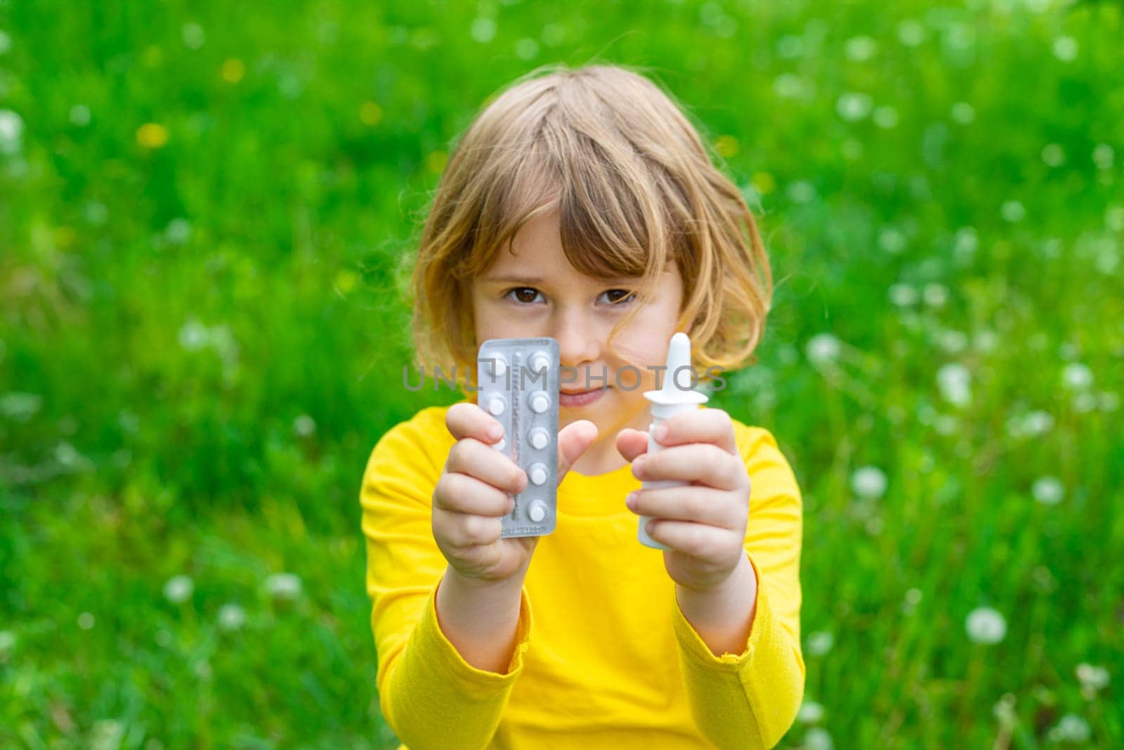 The child is allergic to dandelions. Selective focus. Kid.