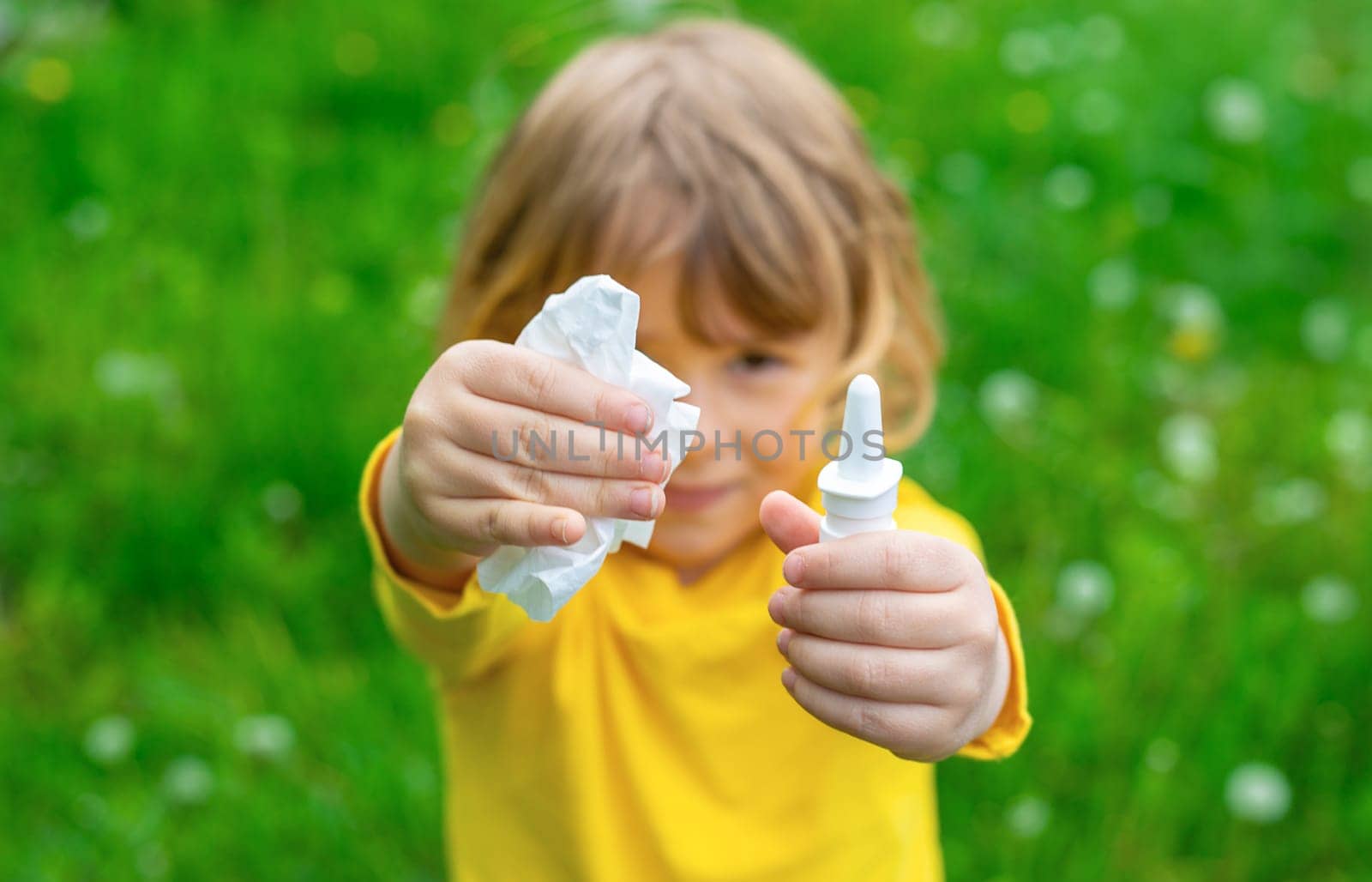 The child is allergic to dandelions. Selective focus. Kid.