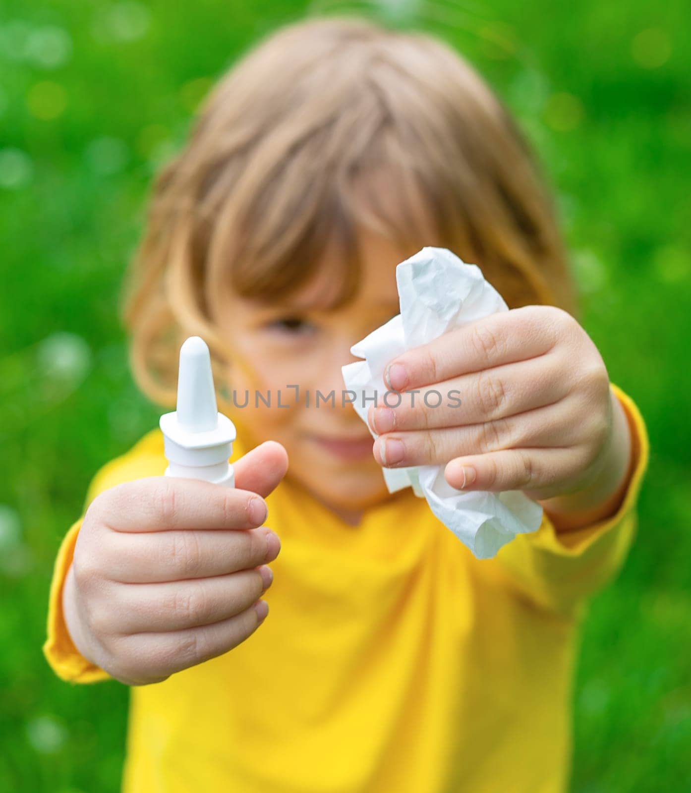 The child is allergic to dandelions. Selective focus. Kid.