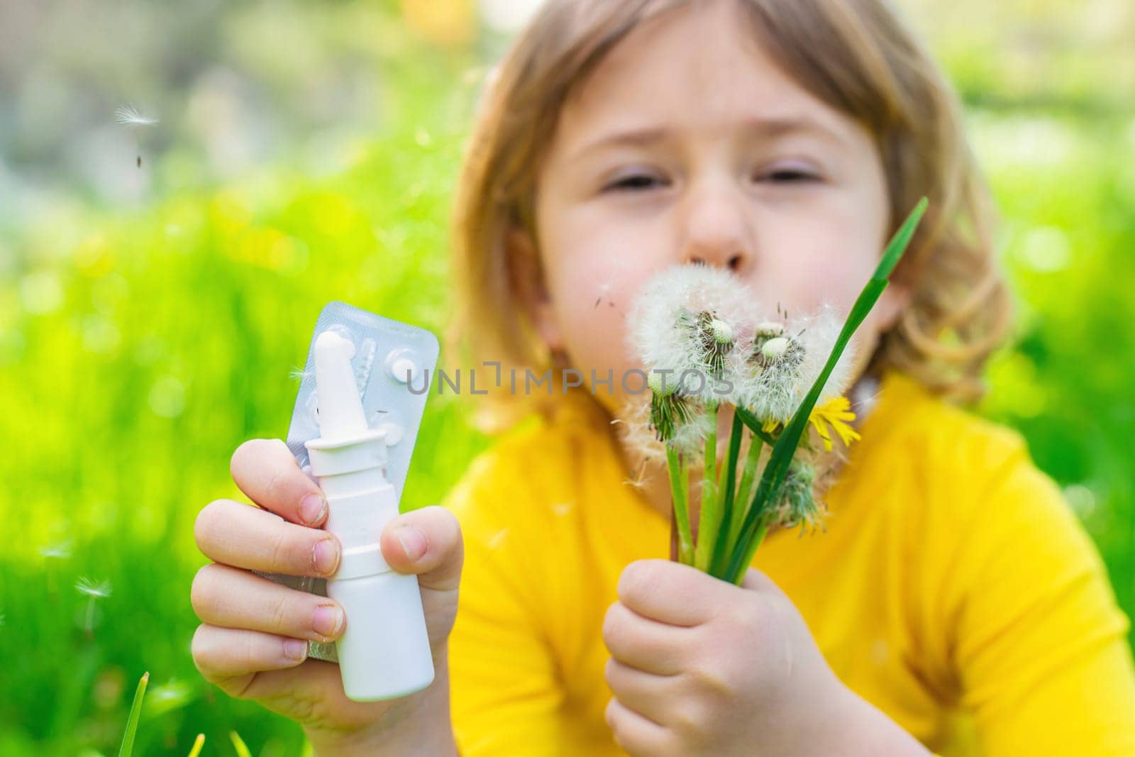 The child is allergic to dandelions. Selective focus. Kid.