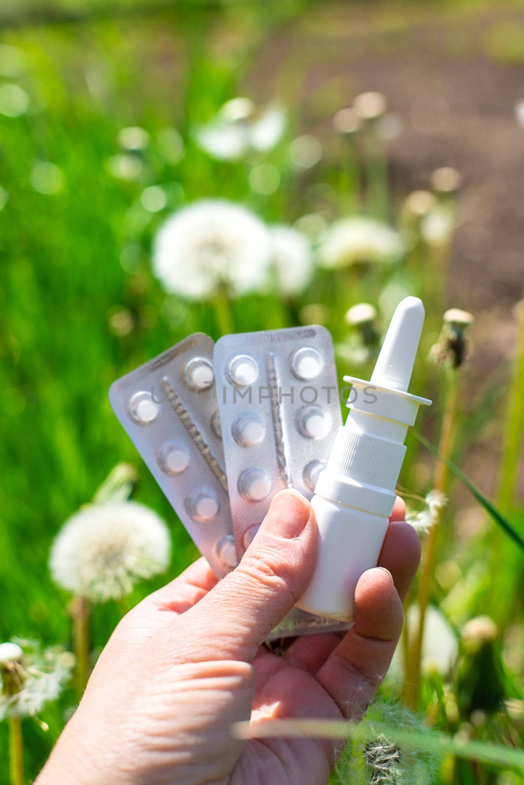 Allergy remedies in hands. Selective focus. Kid.