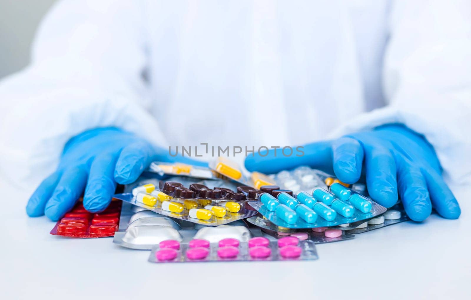 medicines in the hands of a doctor. Selective focus. pills.