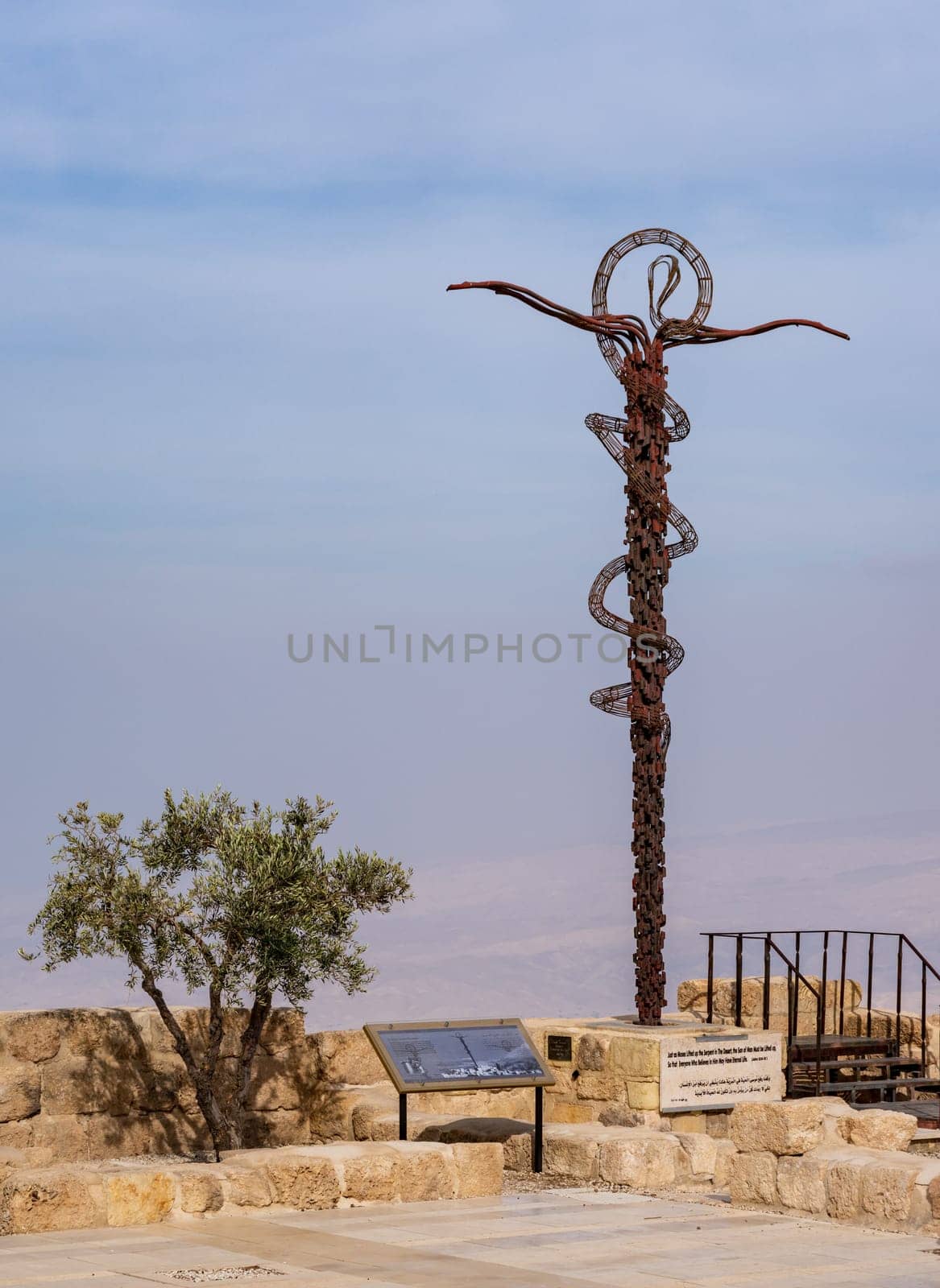 Mount Nebo, Jordan - 9 November 2024: Nehushtan or Brazen Serpent cross by Moses Memorial church created by Paolo Fantoni