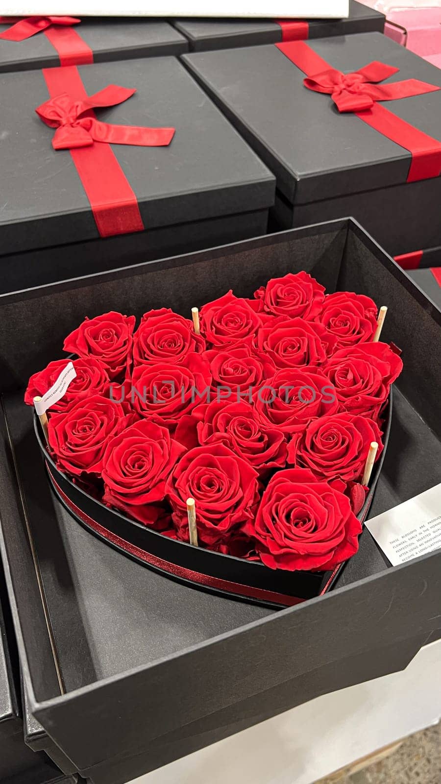 This stunning heart-shaped arrangement features vibrant red roses in an elegant black box, perfect for Valentine s Day, anniversaries, or any occasion to express your love.