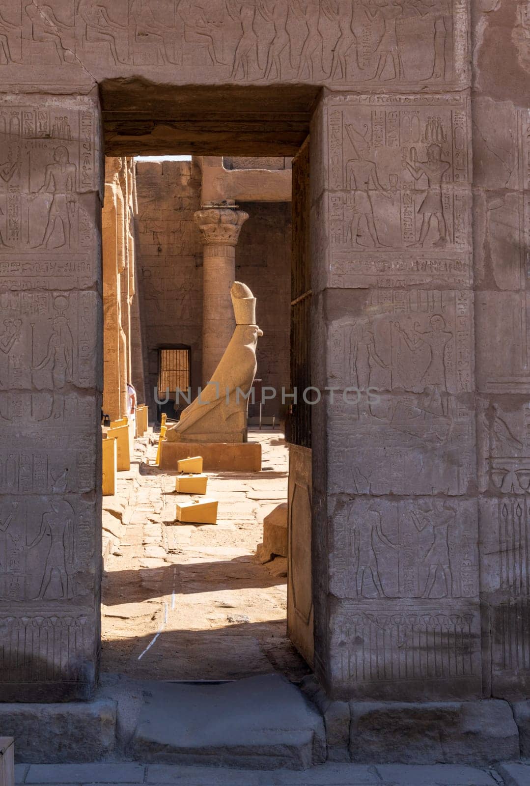 Detail of the carved statue of Horus outside the Pylon at the entrance of the massive temple in Edfu dedicated to Horus and Hathor