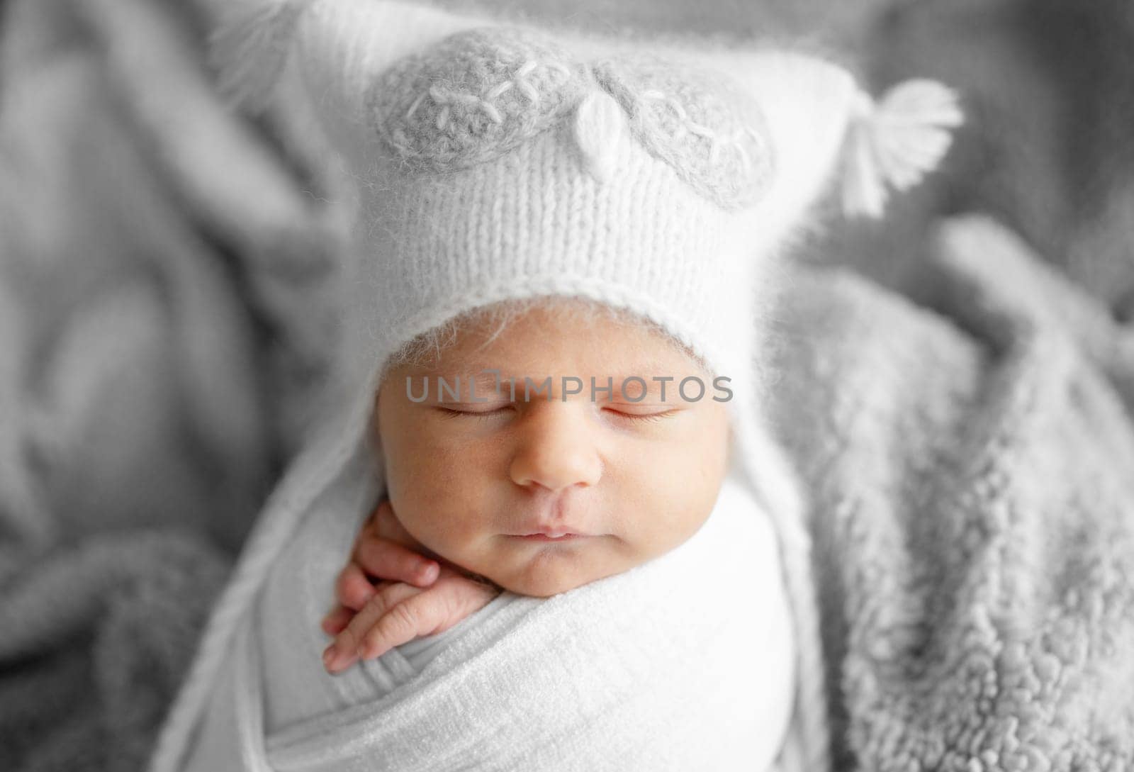Newborn Baby Sleeping In Owl Hat Studio Photo