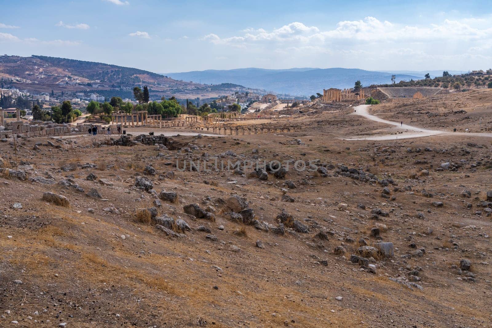 Tourists walking between monuments in Jerash, a Greco-Roman well preserved city in Jordan